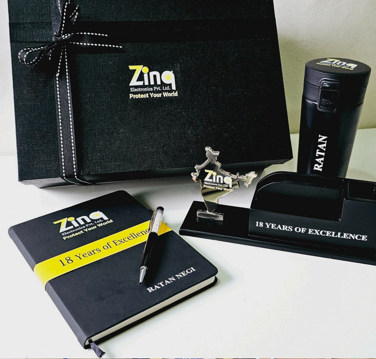 Premium gift box with notebook, pen, award trophy, and tumbler