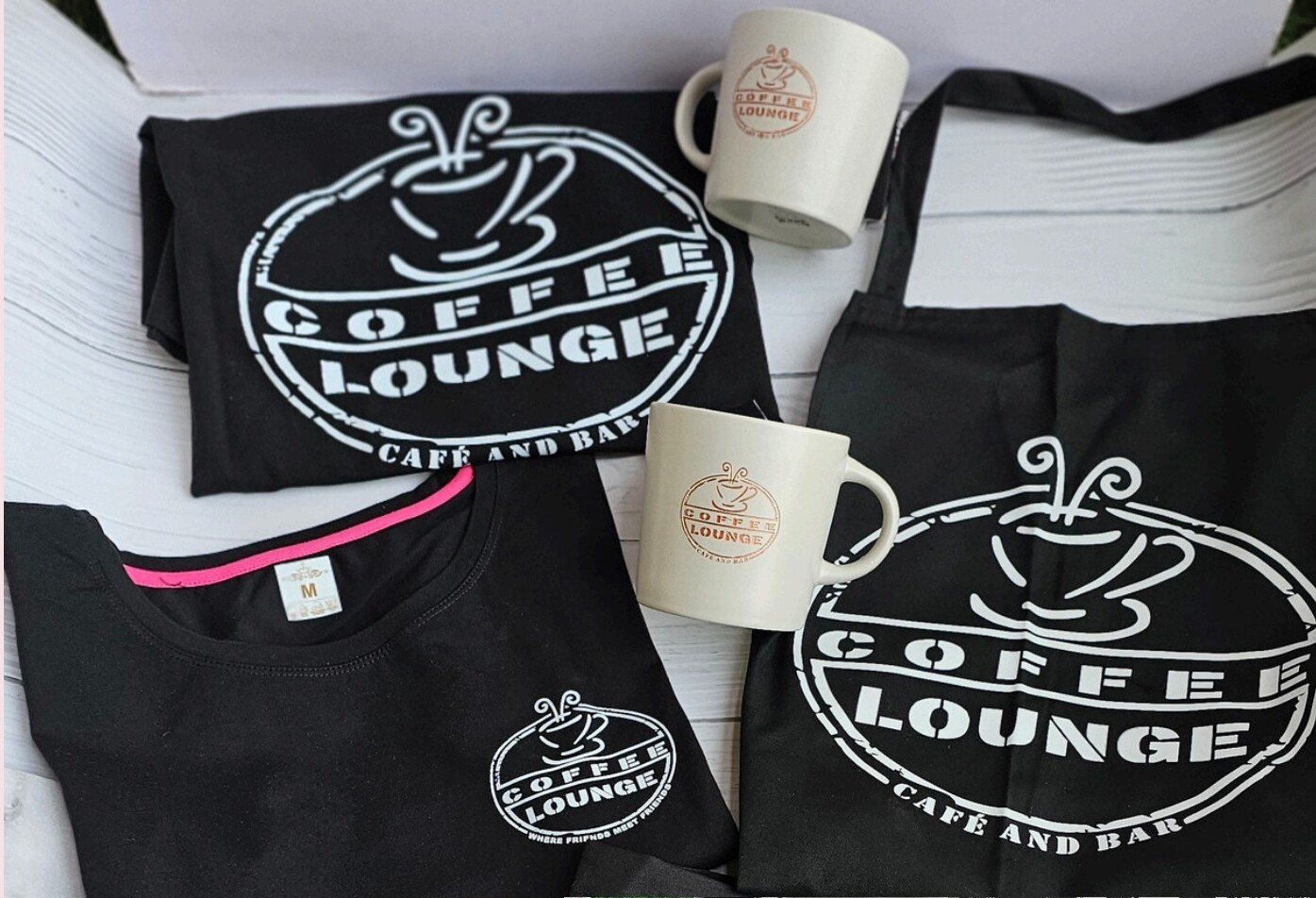 Branded merchandise including t-shirts, aprons, mugs, bags, and coasters